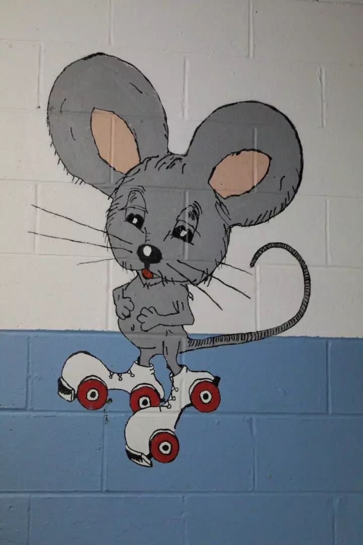 A graffiti of a mouse wearing roller skates