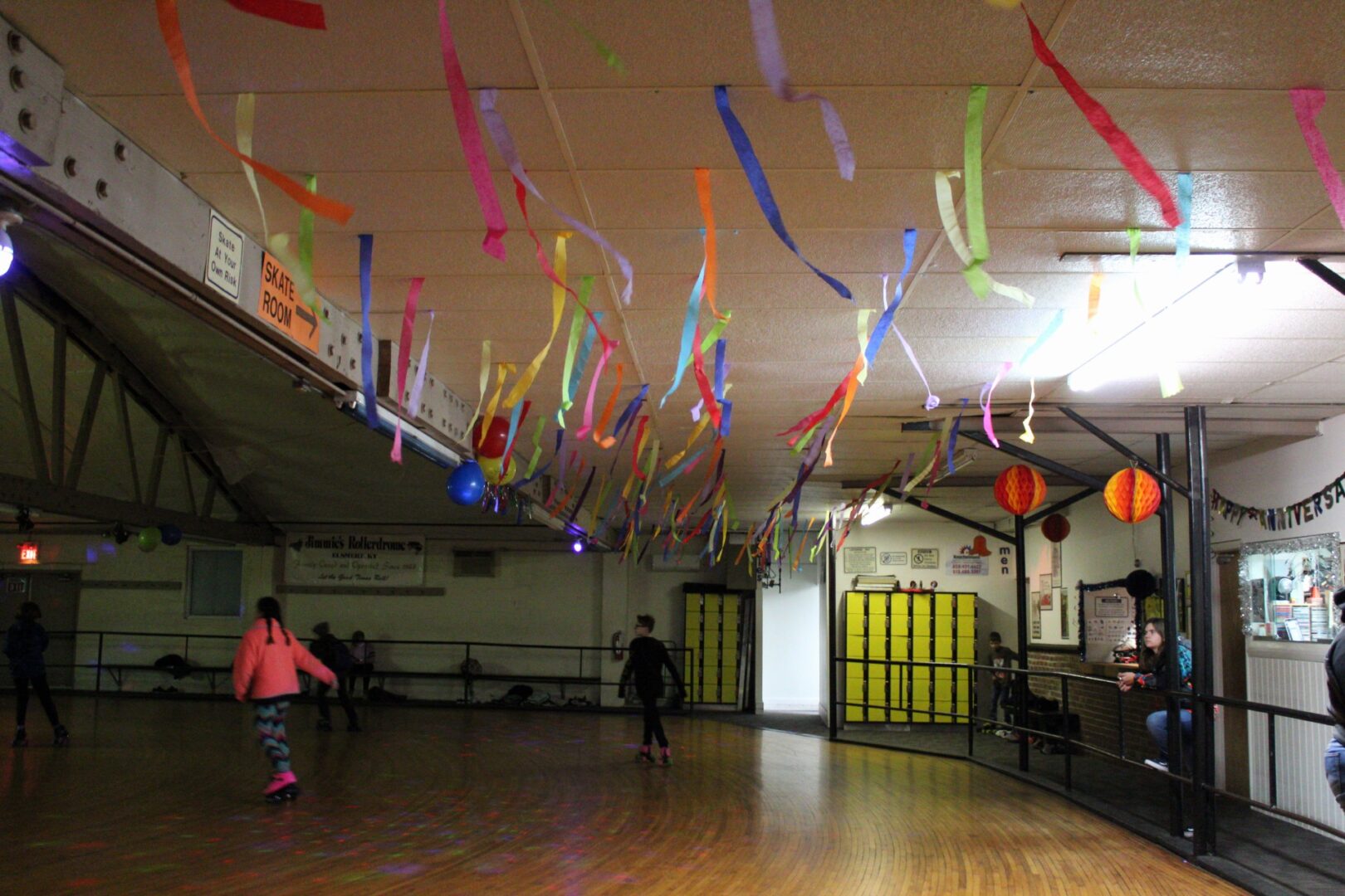 Streamers and decorations on the ceiling above our roller rink