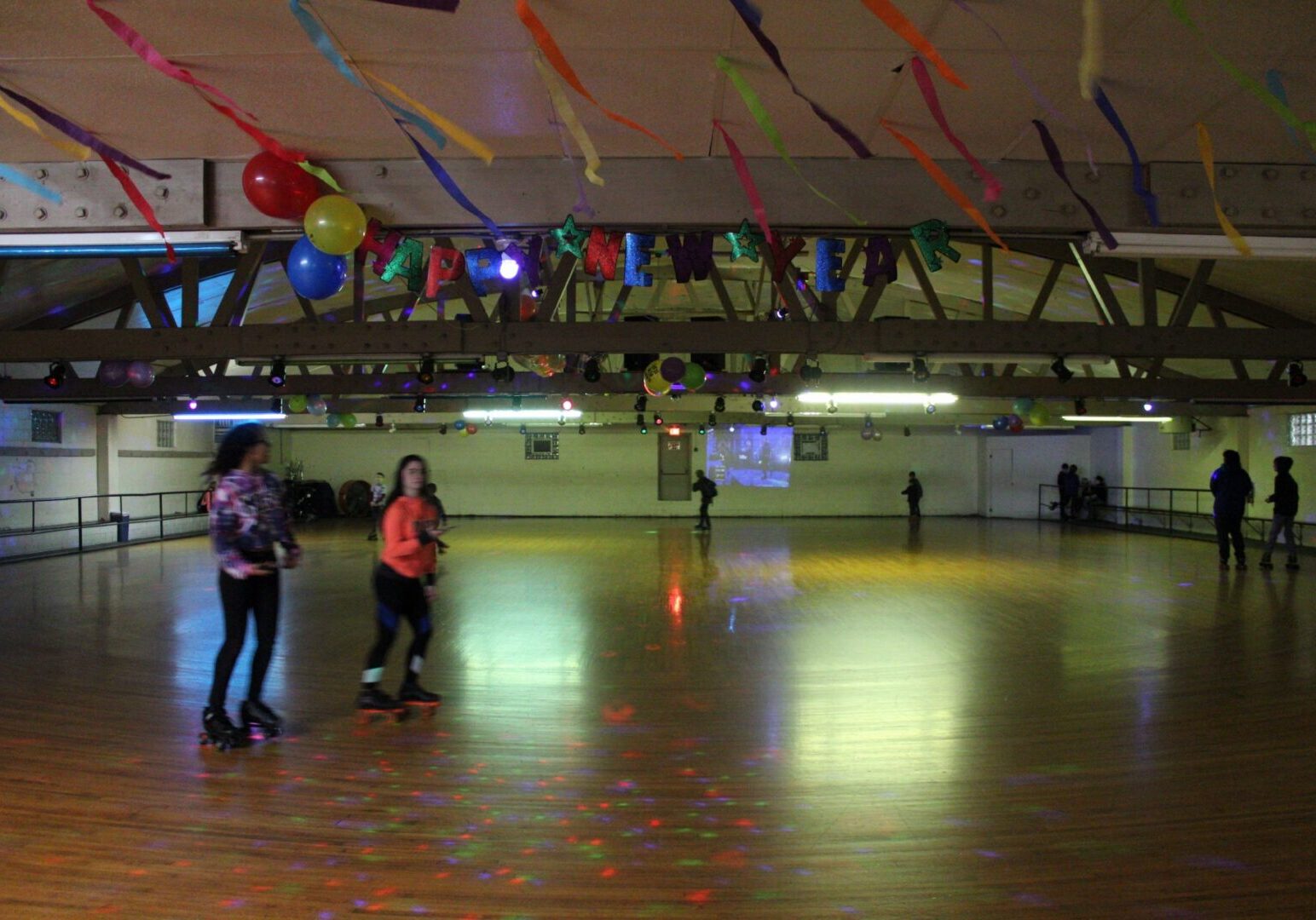 Customers skating on our wooden roller rink